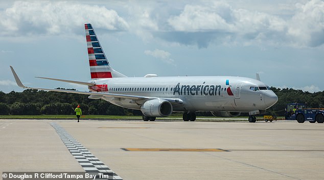 An American Airlines jet was forced to make an emergency landing in Buffalo, New York after an unruly passenger allegedly exposed himself before urinating down the aisle of the plane