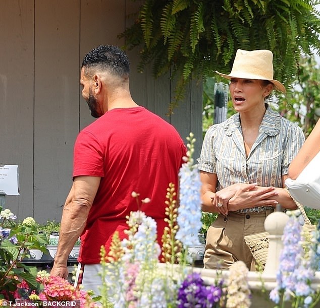 The actress, 54, whose actor spouse, 51, was seen with his wedding ring on this week, flashed her own wedding bands as she was seen with her manager Benny Medina while shopping for plants