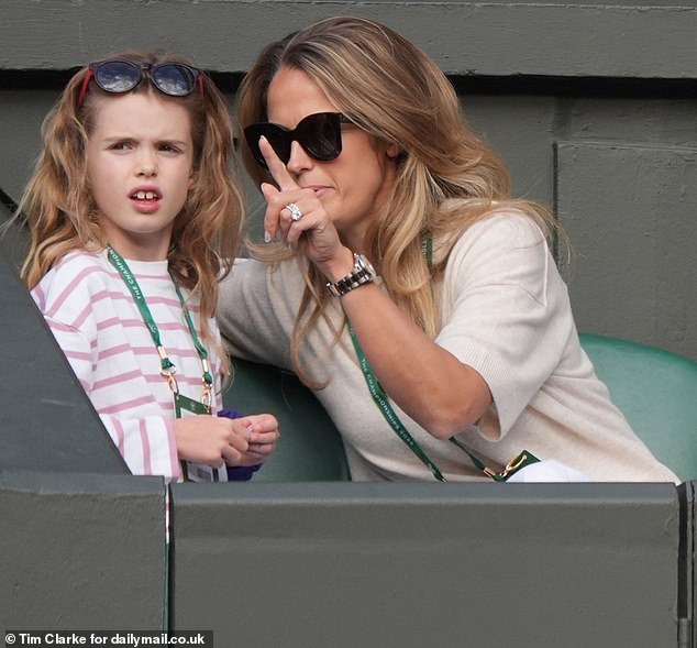 Kim looked excited as she seemingly explained details of the match to her children on day four of Wimbledon