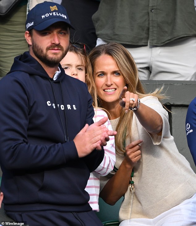 Andy Murray 's wife appeared emotional as she watched her husband and brother-in-law's defeat following a nail-biting doubles match