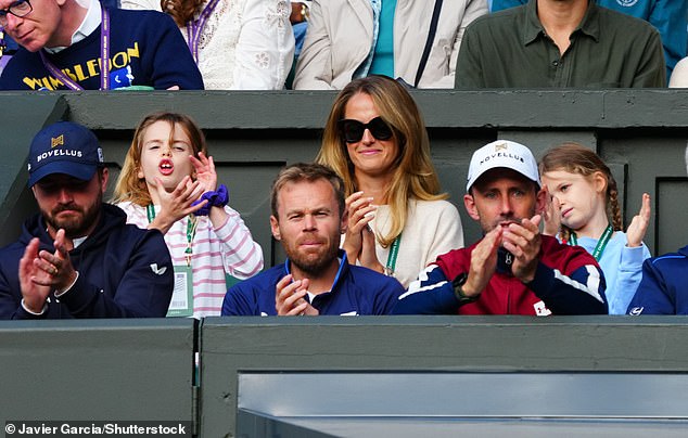 Supportive Kim was happy to applaud her athlete husband from the stands, as she watched the match