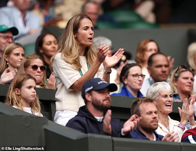 Kim Sears, 36, clapped, cheered, and braved moments of tension as she watched her husband and his brother Jamie lose 7-6 6-4 to Australian duo John Peers and Rinky Hijikata in a tight match on Centre Court this evening