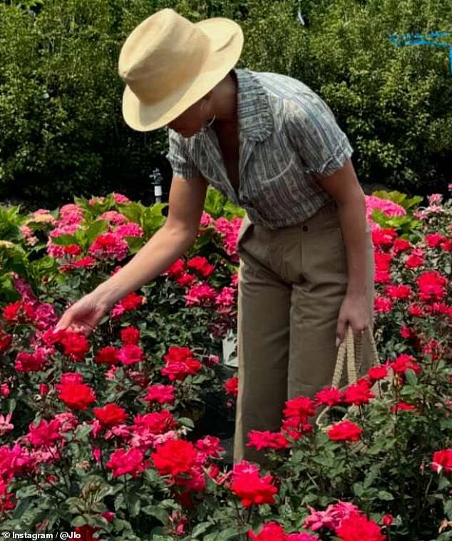 She could be seen wandering among various flowerbeds, occasionally bending down to catch a closer look at a blossom that caught her fancy