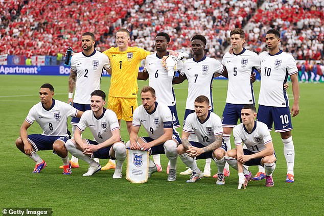 Saka, pictured (no 7) in a team photo ahead of a match against Denmark in the group stage, has started all four of England's games at this summer's Euros so far