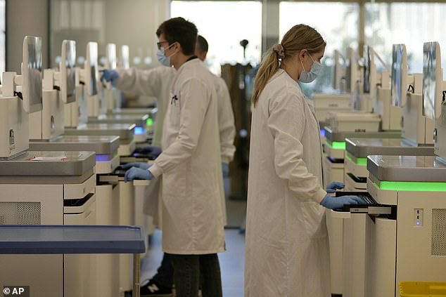 Until now, experts were unsure exactly which specific genetic changes to look out for in the 'tumour protection' gene BAP1 that cause it to malfunction and fuel cancer growth. But researchers in the UK have now discovered more than 5,000 harmful changes to the protein's DNA which can disrupt its protective effects. Pictured, researchers at the Wellcome Sanger Institute in Cambridgeshire