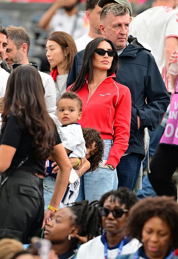 Annie Kilner,  Kyle Walker, was seen watching the game from the stands in a striking red jacket, jeans and shades