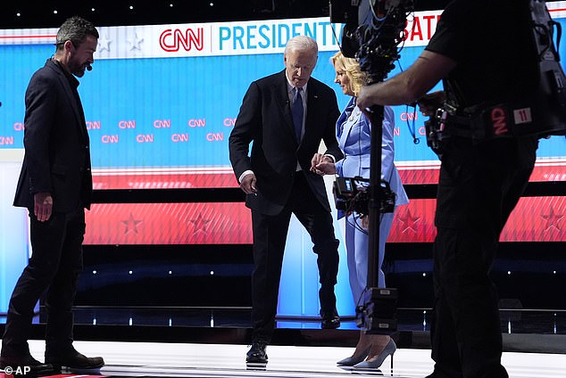 First Lady Jill Biden helps her husband down a step at the CNN debate after his bad showing