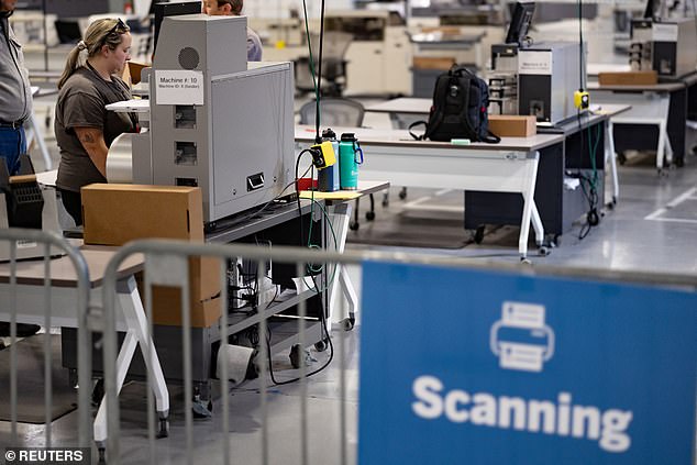 A worker scans ballots cast during the 2022 U.S. midterm election in Philadelphia, Pennsylvania, U.S., November 10, 2022.