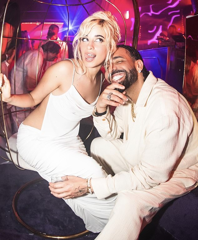 She was photographed cozying up to rapper Drake, 37, at the bash