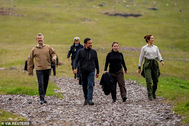 Both looked ready for action in hiking ensembles as they trekked along the countryside. The couple walked to the village along the Kongevejen - a gravel road that takes you from Itilleq to Igaliku, named after Frederik IX who visited in 1952, and is renowned for its stunning views