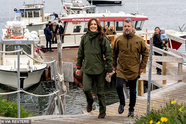 Frederik X, 56, and his wife Mary, 52, grinned for photos in matching waterproof ensembles as they explored the south of the island