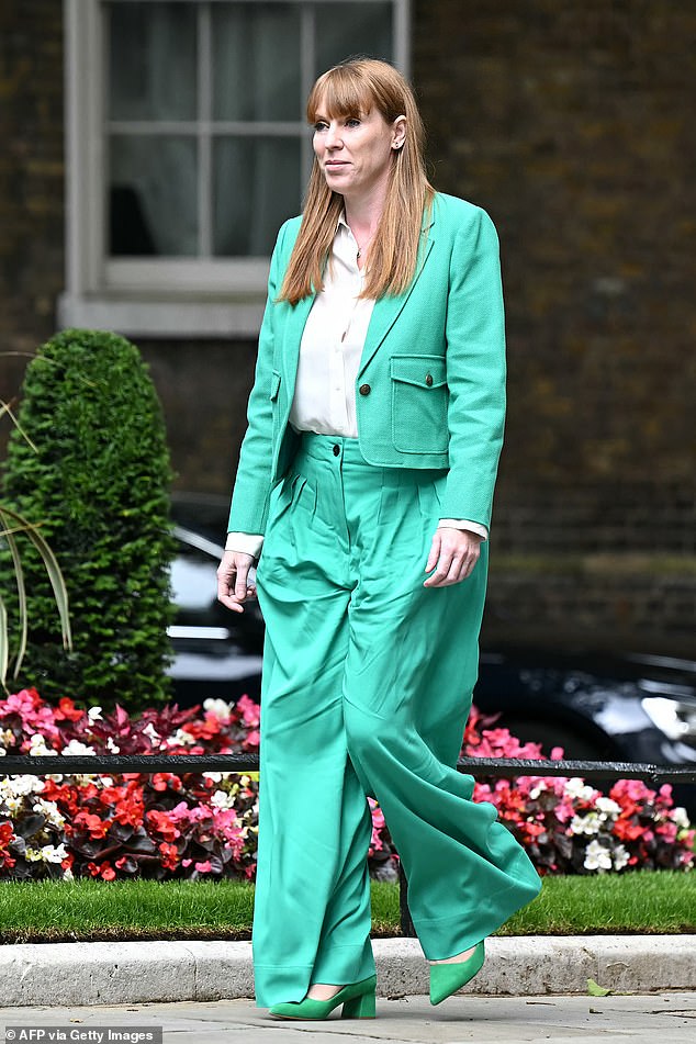 On her first day in office she opted for a turquoise suit with emerald suede heels