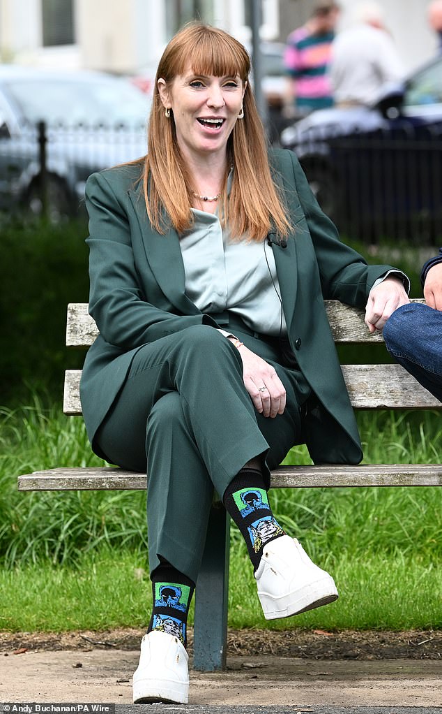 She was also seen in a sage-coloured suit with a pistachio silk shirt - although she was also wearing Marvel comic superhero socks of characters Thor and Black Panther with a hint of green as well