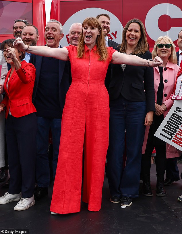 Angela Rayner in a stunning crimson pantsuit as she posed with party supporters at a campaign event on June 28, 2024, in Hamilton, Scotland