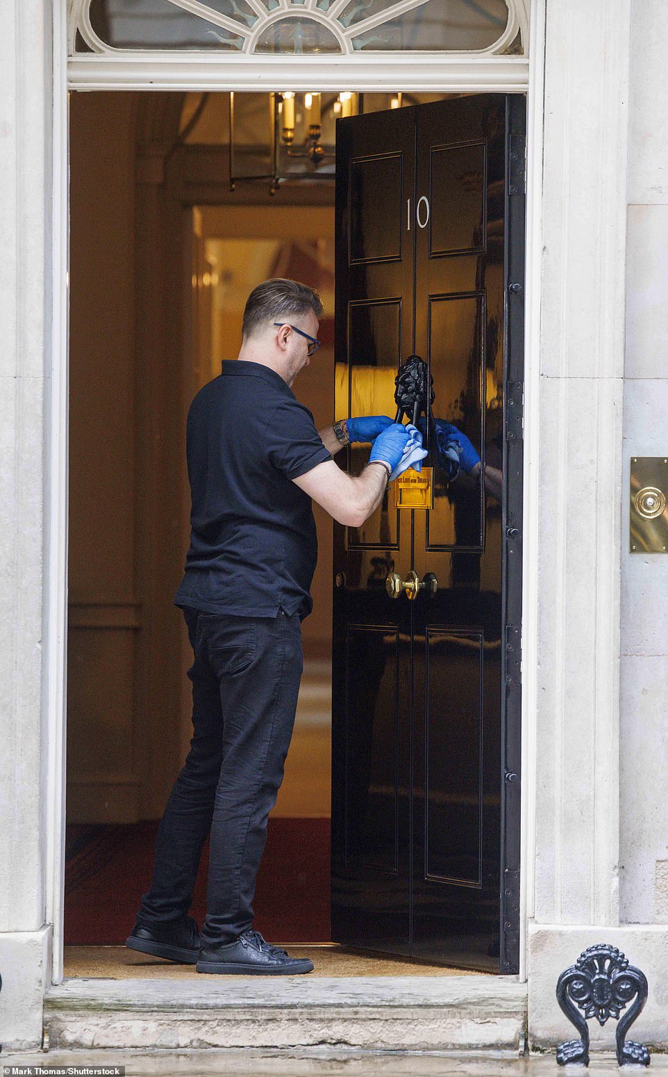 Staff were polishing up the famous Downing Street door today as the new government settles in