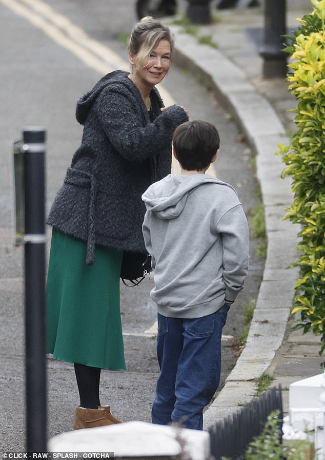 Renee really is mad about the boy in this charming shot of her with a young actor