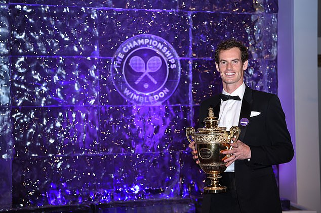 Murray poses with the Wimbledon trophy after claiming his second championship in 2016