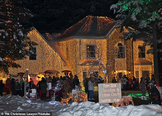 Thousands came to view the bright sight consisting of 200,000 lights alongside costumed characters, musicians and a children's choir