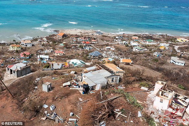 The ferocious hurricane already killed at least 11 people in St Vincent and the Grenadines, Grenada, Jamaica and Venezuela and caused significant damage to parts of the Caribbean. Pictured: Destruction on the island of Petite Martinique, Grenada
