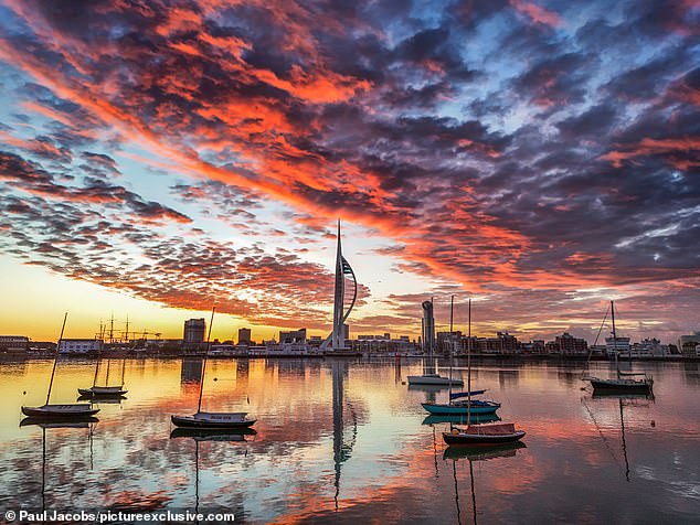The sunrise over Portsmouth and the Spinnaker Tower in Hampshire this morning at 5am