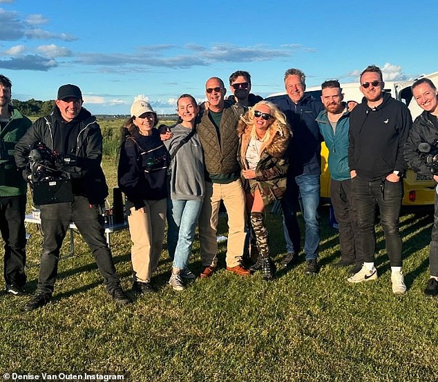 Denise also shared a group snap with Johnny and the entire camera and production crew on location