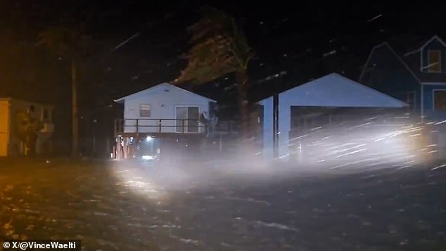 Forecasters warn conditions in Texas are 'deteriorating' as the 'life-threatening' super storm moves inland. Up to 15 inches of rain is expected today and tornadoes are possible across much of the eastern part of the state. Pictured is a flooded street in Matagorda, Texas around 12.30am Monday, before the storm made landfall