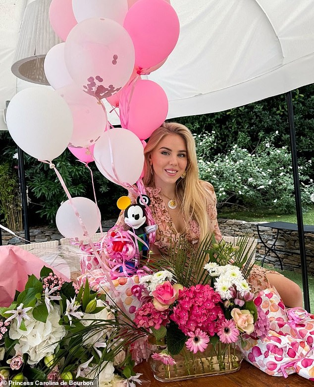 Another snap showed Chiara surrounded by flowers and balloons as her parents held up two cakes for her