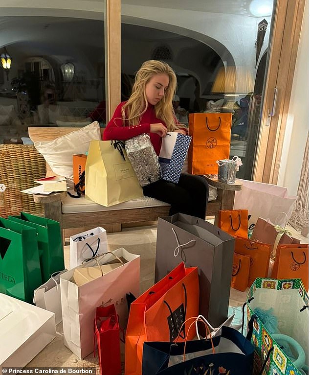 Pictured: the Princess is surrounded by dozens of bags of gifts, including six shopping bags for ultimate luxury retailer Hermes, were bags cost as much as £30,000 and scarves sell for £450