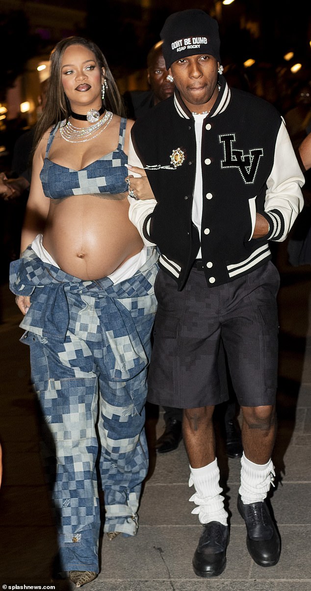 A heavily-pregnant Rihanna is pictured attending Paris Fashion Week with Asap Rocky, showing off her baby bump