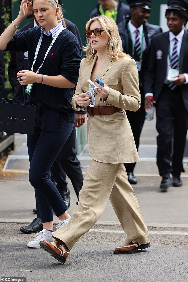 Sex Education star Bella Maclean looked chic in a beige linen suit teamed with a chunky brown leather belt