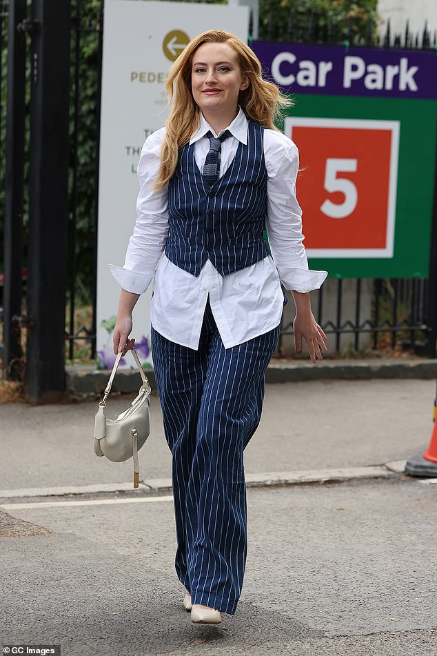 Amelia Dimoldenberg looked smart in a striped waistcoat over a white shirt and a matching tie