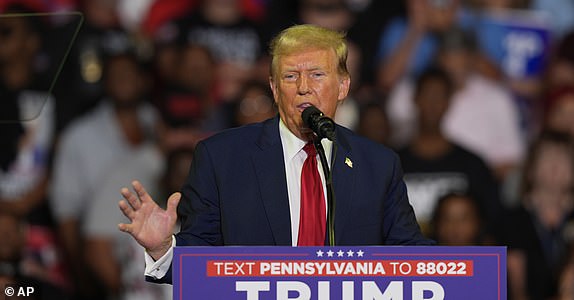 FILE - Republican presidential candidate former President Donald Trump speaks at a campaign rally, June 22, 2024, in Philadelphia. Trump is seeking to distance himself from a plan for a massive overhaul of the federal government drafted by some of his administration officials. Some of these men are expected to take high-level roles if the Republican presumptive nominee is elected back into the White House. Trump is saying on Truth Social that he "knew nothing about Project 2025." (AP Photo/Chris Szagola, File)