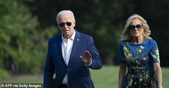 TOPSHOT - US President Joe Biden and First lady Jill Biden walk to the White House in Washington, DC, on July 7, 2024, as they return after attending campaign events in Pennsylvania. (Photo by Chris Kleponis / AFP) (Photo by CHRIS KLEPONIS/AFP via Getty Images)