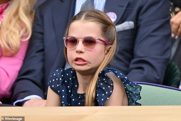 Keeping it cool! Princess Charlotte opted for RayBans as she watched from the box