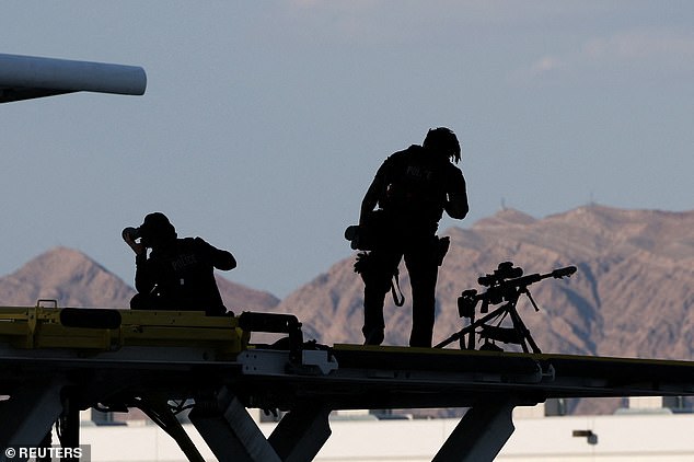 Members of the U.S. Secret Service Counter Sniper team stand guard near Air Force One at Harry Reid International Airport in Las Vegas