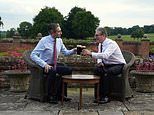Making himself at home! Keir Starmer poses with a pint of Guinness in Chequers garden alongside Irish leader Simon Harris at the Prime Minister's official country retreat less than two weeks after he was elected