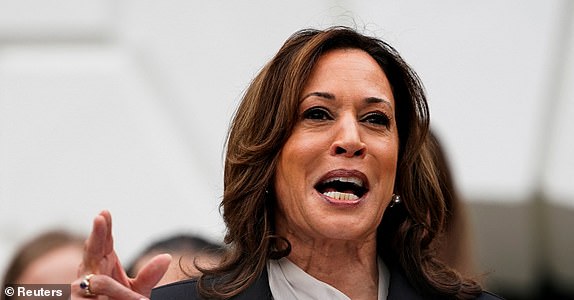 U.S. Vice President Kamala Harris, delivers remarks to the women and men's National Collegiate Athletic Association (NCAA) Champion teams in her first public appearance since President Joe Biden dropped out of the 2024 race, on the South Lawn of the White House, Washington, U.S., July 22, 2024. REUTERS/Nathan Howard