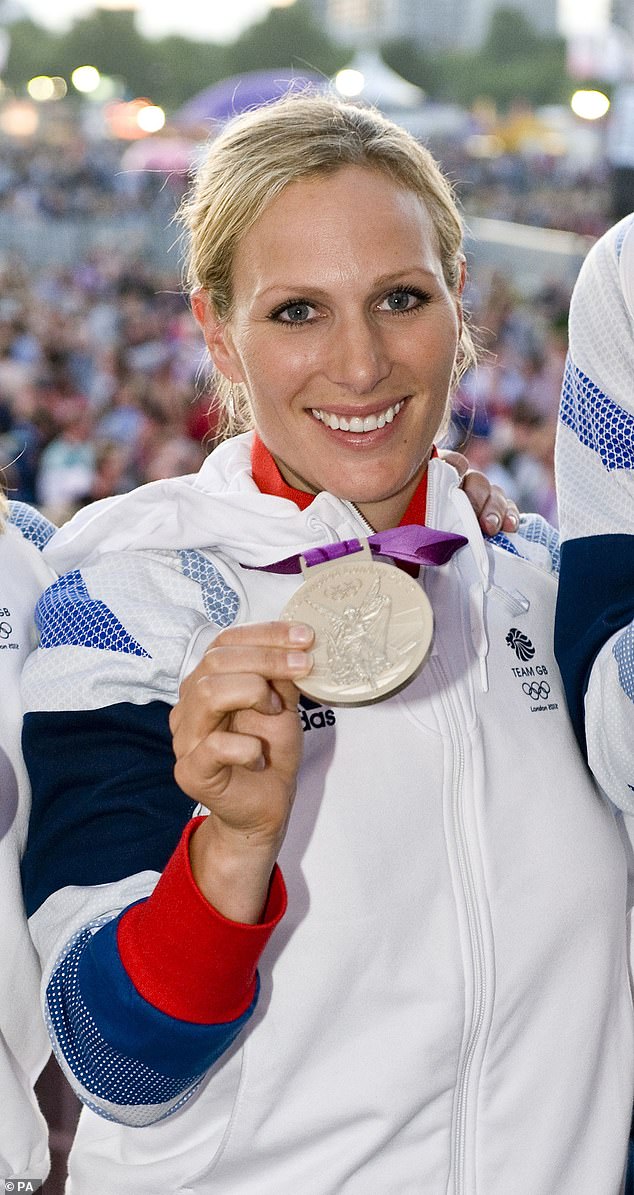 Zara Tindall holding her silver medal at the London 2012 Olympics in Hyde Park