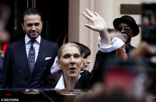 Celine looked beautiful in a baggy black suit which she wore with an open white shirt and she waved at fans