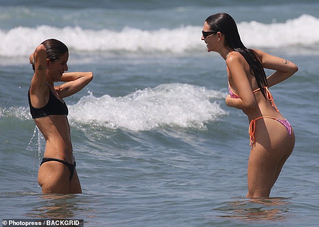 She looked in great spirits as she enjoyed a dip in the sea with her pal