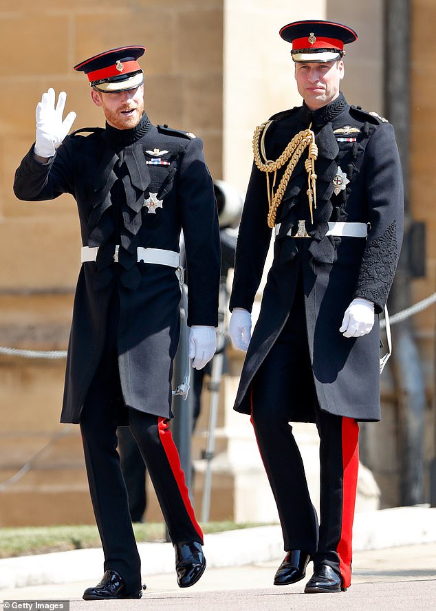 Prince Harry waves to the crowd as he walks alongside Prince William at St George's Chapel in Windsor Castle before his wedding to Meghan Markle in May 2018