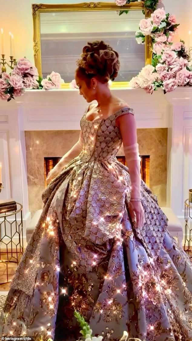 In a video montage shared to the superstar's Instagram, she stunned in an elaborate blue ballgown with gold details that sparkled in the dark