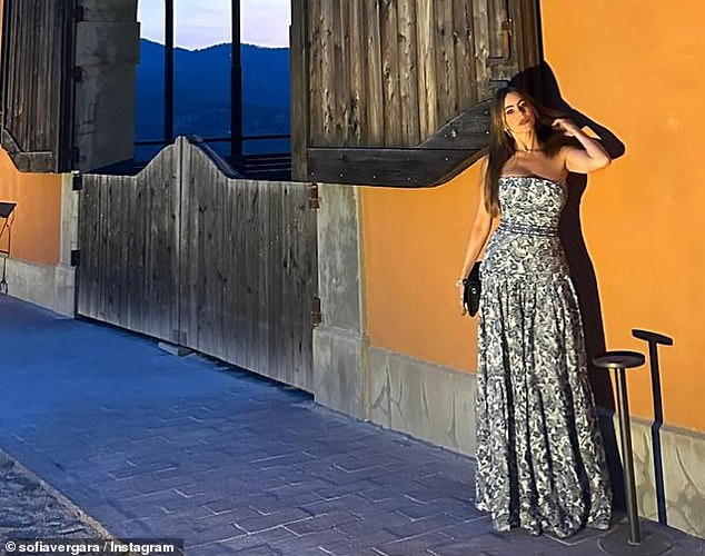 Sofia Vergara dazzled in a blue floral dress as she shared photos from her Italian getaway with boyfriend Justin Saliman and son Manolo