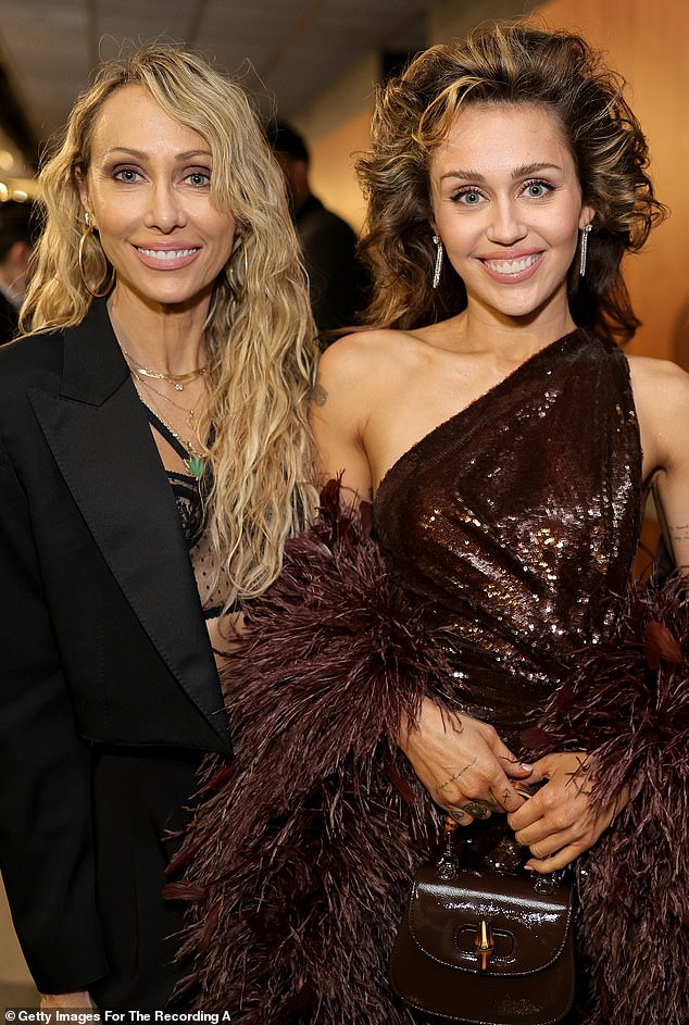 Miley Cyrus appeared to show support for her mom Tish Cyrus after her father Billy Ray Cyrus' expletive-filled rants were obtained exclusively by DailyMail.com on Wednesday