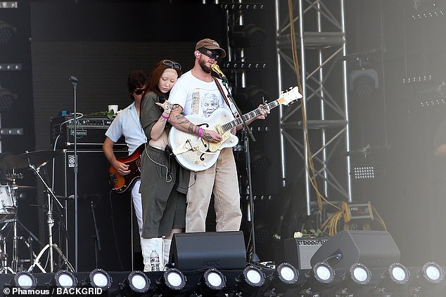 The openly gay South African singer wore one of his customary masks, and he had on a white Nelson Mandela T-shirt