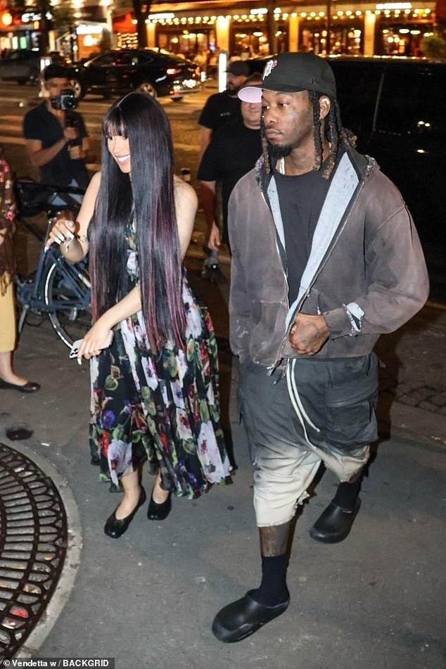 Cardi allegedly separated from her husband Offset (R) for the second time last November, but they certainly put on a strong united front at Disneyland Paris with their children on July 9