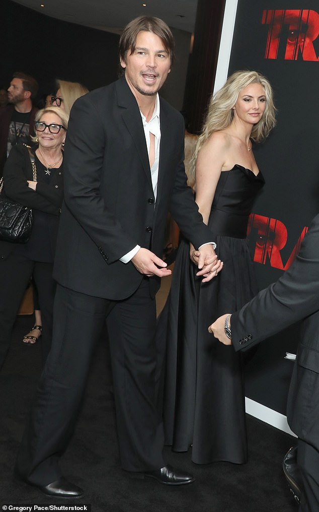 Tamsin proudly held hands with her husband as they attended his premiere