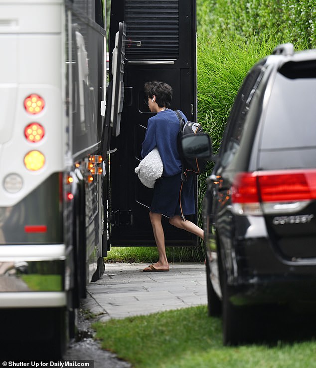 The star's son Max, 16 was seen getting on the bus