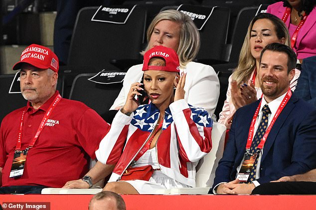 Amber Rose sits in the audience at the Republican National Convention two nights after delivering a speech onstage - which brought her newfound fame on the American right, with her saying she posed for '3,000 pictures in four days'