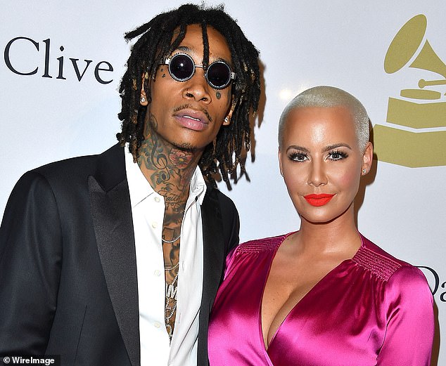 Wiz Khalifa (left) and Amber Rose (right) at a music industry event in 2017. The couple are divorced now, but Rose divulged that the Black and Yellow rapper encouraged her to be publicly supportive of the MAGA movement